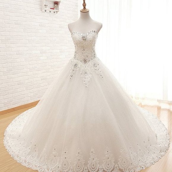 Dresses & Skirts - WEDDING DRESS with crystals ,it is an amazing dress.